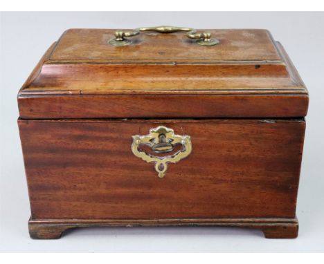 A George III rectangular mahogany tea caddy, the moulded hinged top enclosing three divisions, a concealed drawer below acces