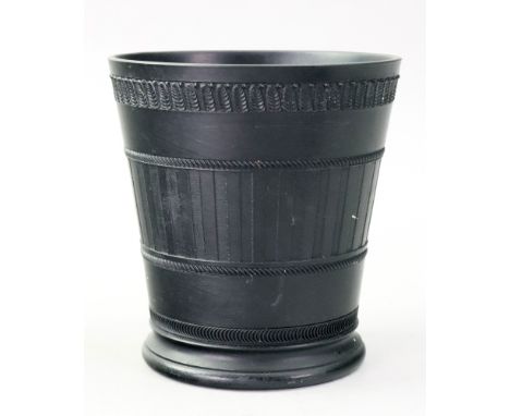 A Wedgwood black basalt cache pot, 20th century, the floral sides engine turned with a band of flutes beneath an acanthus lea