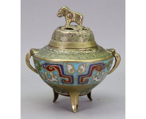 A Chinese cloisonne tripod censer, 20th century, decorated around the body with taotie masks, the pieced cover with elephant 