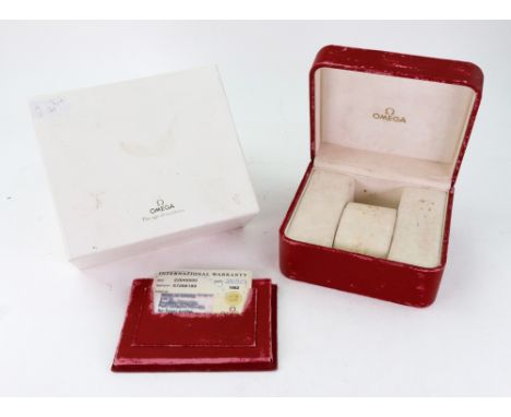 A vintage Omega red leather covered watch box, with red leather pouch containing Omega International Warranty card ref. 22645