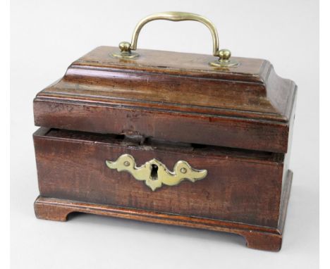 A George III rectangular mahogany tea caddy, with stepped moulded hinged cover and brass carrying handle, enclosing two tin c