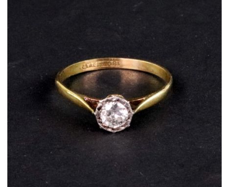An early 20th century gold and diamond solitaire ring, the early modern round brilliant approximately 0.33cts, illusion-set i