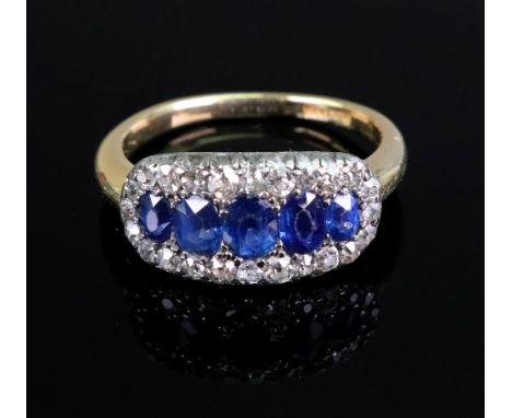 An early to mid 20th century gold, sapphire and diamond oval cluster ring, centred with five graduated oval mixed-cut sapphir