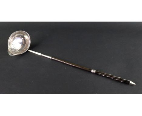 A George III silver punch ladle, George Smith, London 1778, the oval side pouring bowl with beaded edge, silver mounted twist
