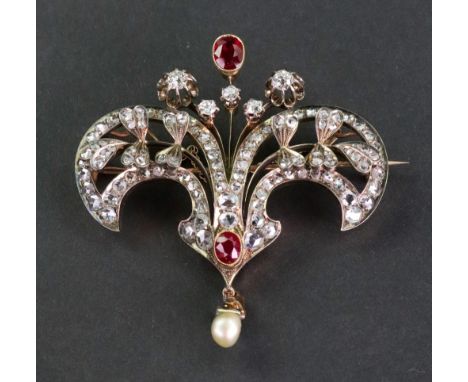 A late Victorian gold, synthetic-ruby and diamond floral double-scroll brooch, each open scroll with a rose diamond border an