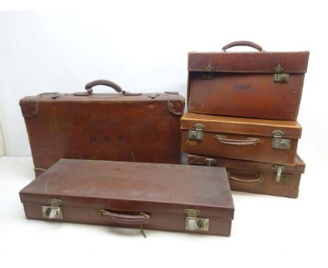 Collection of early 20th century suitcases, travel trunk and briefcase, two having H.W.P initials, L69cm max (5) Condition Re