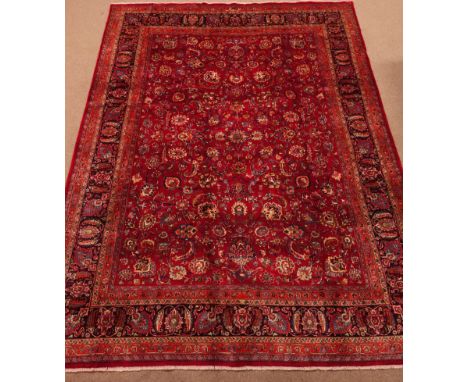 Fine quality Persian Meshed carpet, floral design on red ground field, repeating border, decorated with stylised flower heads