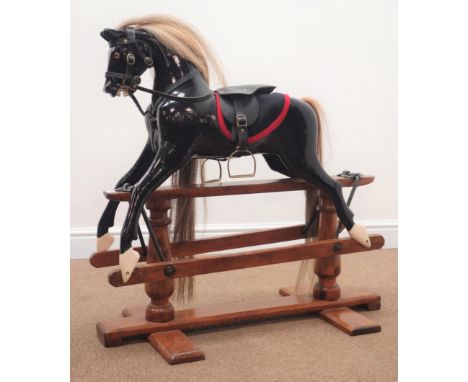 19th century painted rocking horse, saddle stirrups and briddle, trestle base, L90cm, H86cm Condition Report Click here for f