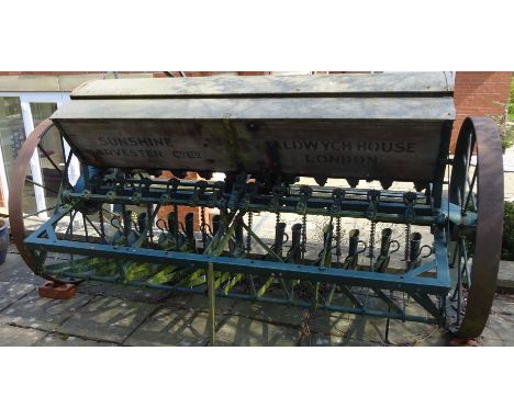 Vintage Sunshine Harvester Co.Ltd. Aldwych House, London 12 row Seed Drill, with wooden stencilled hopper on iron spoked whee