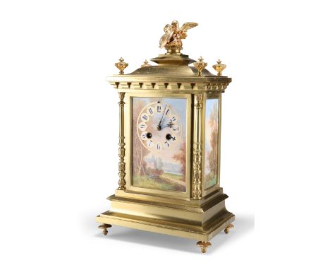 A LATE 19TH CENTURY FRENCH PORCELAIN-MOUNTED BRASS MANTEL CLOCK, the case with three landscape-painted porcelain panels, the 