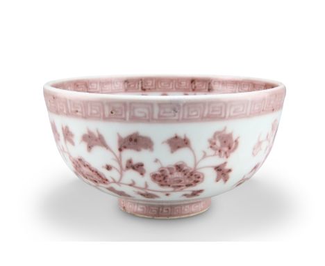A CHINESE MING-STYLE COPPER-RED BOWL, circular, painted with lotus flowers and scrolling tendrils. 19.5cm diameterCONDITION R