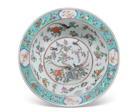 A CHINESE FAMILLE ROSE PORCELAIN BASIN, 19TH CENTURY, circular, enamel painted with peacocks and other birds amidst rockwork 