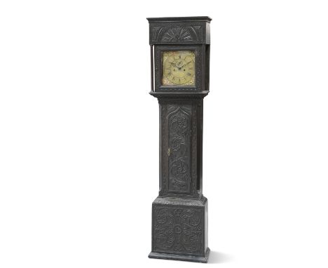 A CARVED OAK EIGHT-DAY LONGCASE CLOCK, the 10½-inch square brass dial signed Thos. Morpeth, Hexham and dated 1735, the case w