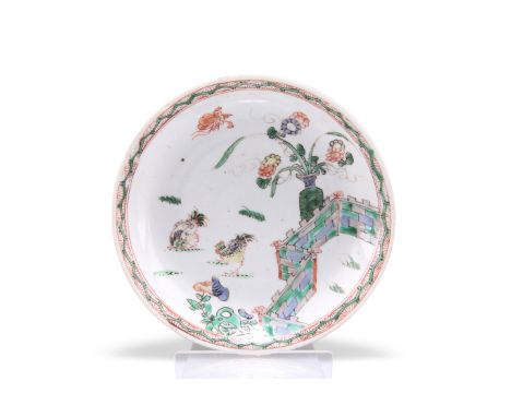 A CHINESE FAMILLE VERTE SMALL SAUCER DISH, KANGXI, circular, painted in the characteristic palette with chickens, zig-zag wal