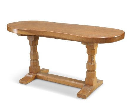 ROBERT THOMPSON OF KILBURN, A MOUSEMAN OAK KIDNEY-SHAPED SIDE TABLE, the substantial 59-inch adzed top raised on large facete