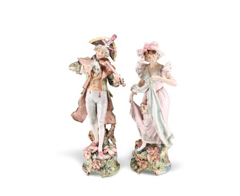 A LARGE PAIR OF VIENNESE FAIENCE FIGURES, PROBABLY GOLDSCHEIDER, modelled in 18th Century dress, he standing playing a violin