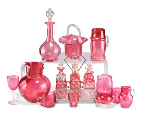 A COLLECTION OF VICTORIAN CRANBERRY GLASS, including silver-plated six-bottle cruet, jugs, small decanter, basket, etc. (Qty)