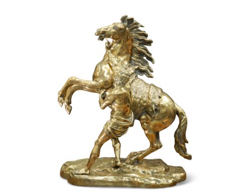 AFTER COUSTOU, A LARGE 19TH CENTURY BRASS MODEL OF A MARLEY HORSE, in typical pose. 57cm high