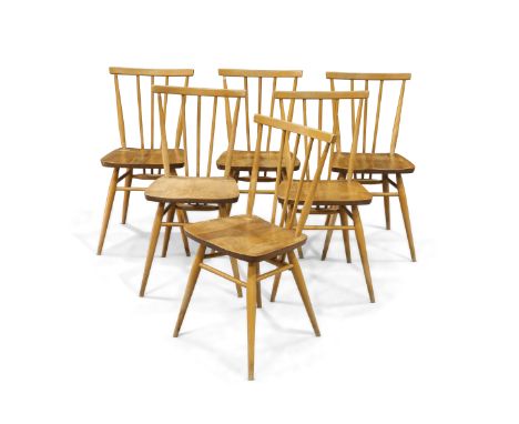 A SET OF SIX ERCOL WINDSOR LIGHT ELM DINING CHAIRS, CIRCA 1960S, each with spindle back and splayed legs, blue labels. (6) He