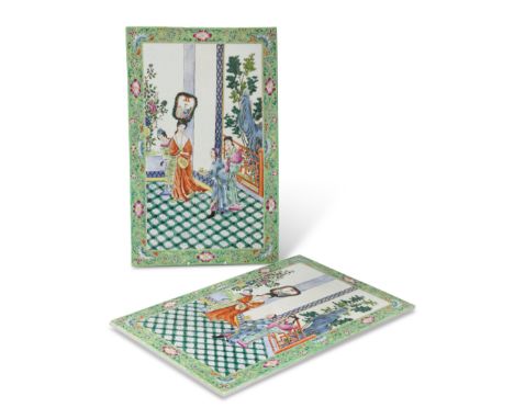 A LARGE PAIR OF CHINESE PORCELAIN PLAQUES, rectangular, enamel painted with figures in an interior, the green border painted 