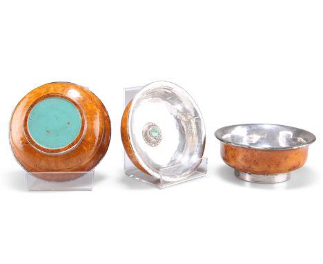 THREE TIBETAN BURR WOOD AND TURQUOISE BOWLS,&nbsp;shallow form with burr wood exteriors and white metal interiors, each set w
