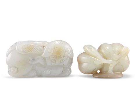 TWO CHINESE JADE CARVINGS, including A BUDDHISTIC LION playing with a brocade ball, 4cm by 6.5cm; and A LOTUS POD, 2.5cm by 5
