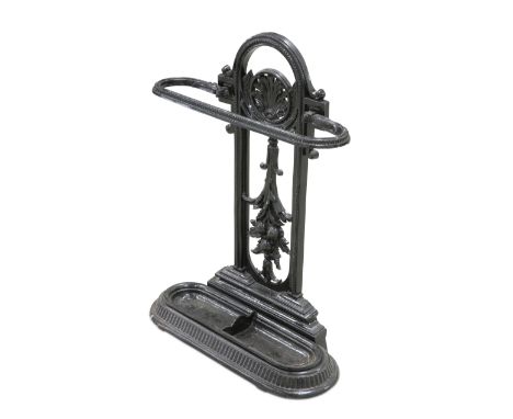 A VICTORIAN CAST IRON STICK STAND, with shell-form crest, registration lozenge verso. 70.5cm high