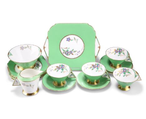 ERIC SLATER FOR SHELLEY, AN ART DECO VOGUE 'HORN OF FLOWERS' PATTERN PART TEA SERVICE, CIRCA 1931, in green, blue and gilt en