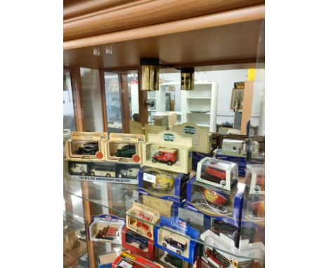 Shelf of car models to include lledo . 