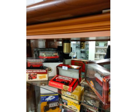 Shelf of bus and tram models includes yesteryear. 