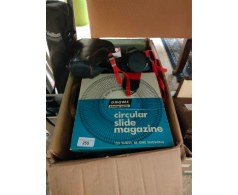 box of vintage camera items includes cannon camera . 