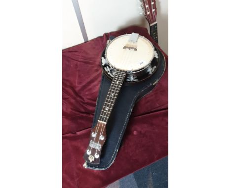Vintage Good quality Banjo  Ukulele  in fitted case with spares strings and Tuner. 