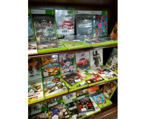 Shelf of Xbox 360 games . 