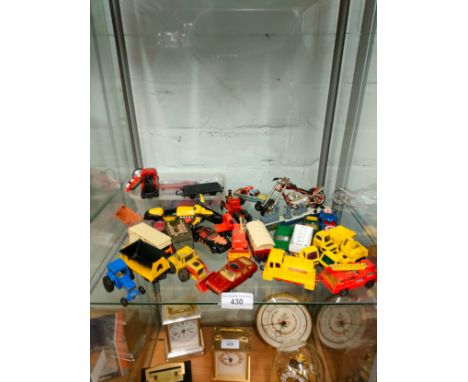 Shelf of playworn vehicles. 