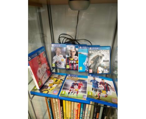 Shelf of playstation 4 games . 