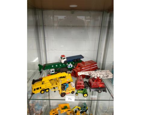 Shelf of play worn vehicles includes corgi Allis chambers fork lift etc . 