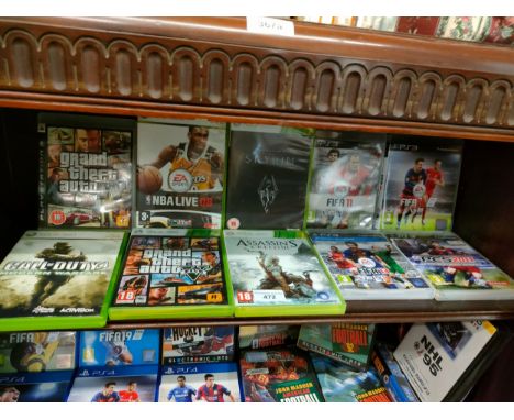 Shelf of Xbox 360 games . 