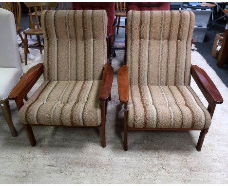 A pair of mid century upholstered light oak arm chairs, in the manner of Parker Knoll, 92cm x 79cm x 73cm.