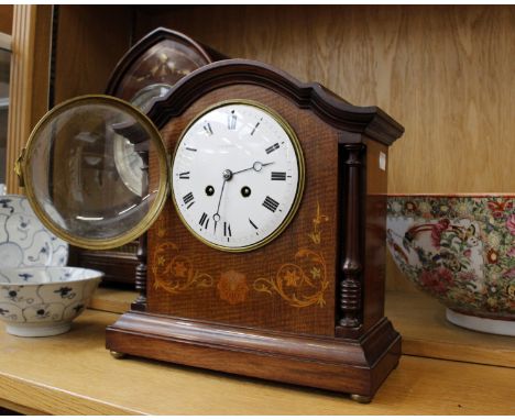An Edwardian Mahogany mantle clock by JW Benson, with inlay decoration, white enamel dial with Roman numeral markers.