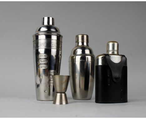 Two cocktail shakers to include a twist recipe example, together with a hip flask and a turned steel 'shot'.