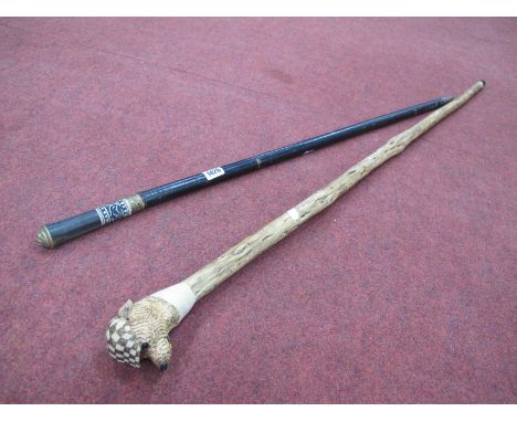 Ebonized Sword Stick, probably Indian, having gilt lion head finial, 91.5cm long overall; carved wooden walking stick, the ha