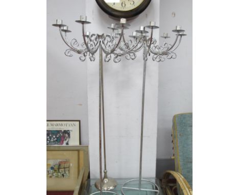 Pair of White Metal Eight Branch Candelabra on Stands, 102cm high; a similar single stick. (3)