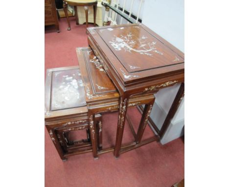 A Nest of Four Chinese Hardwood Chrome Tables, with allover mother of pearl inlay as foliage.