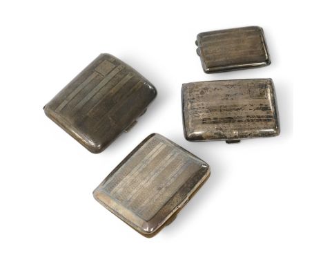 Three assorted George V silver cigarette cases and a silver matchbook case. Condition - fair