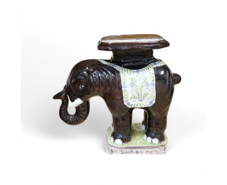A modern Chinese style pottery conservatory seat in the form of an elephant, 64cm wide. Condition - fair