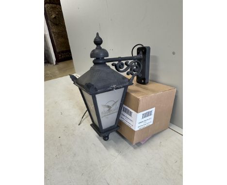A set of four cast metal lantern wall lights with perspex windows, height 60cm. Condition - fair
