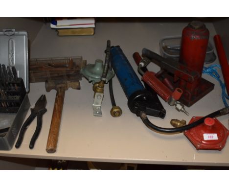 A selection of DIY and building tools including gas torches