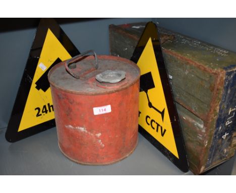A military ammunition case, a petrol can and two Cctv signs