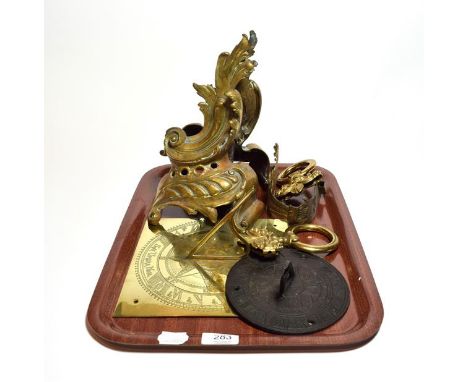 Brass sundial, a bronzed sundial, a pair of andirons and a pair of gilt tie backs (6)