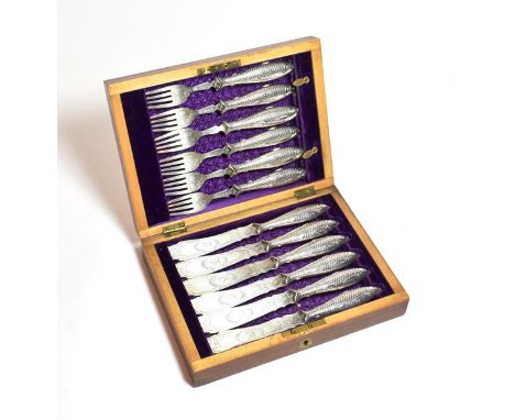 A rare cased set of Victorian silver fish-eaters, by Martin and Hall, Sheffield, The Knives 1867, The Forks 1868, the handle 